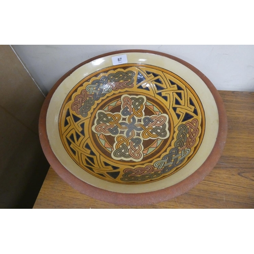 87 - Large terracotta Celtic design bowl, 34cm diameter.