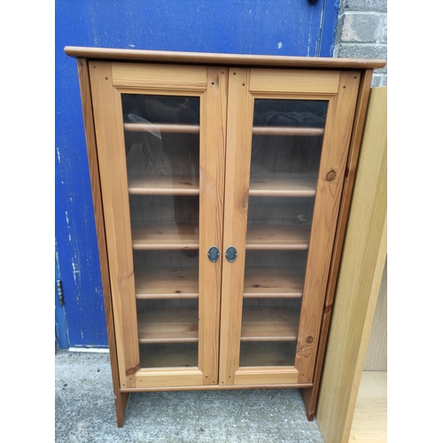 408 - Pine glazed two door cabinet 111cm high and a laminate open bookcase.