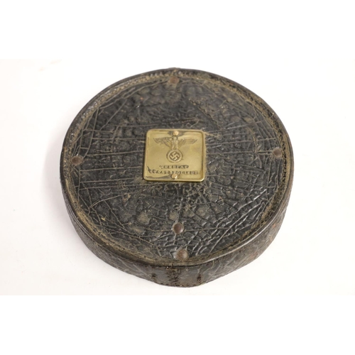 760 - Black leather circular box top with WWII Nazi German brass plaque 'Geneime Staatspolizei M6', 19cm d... 