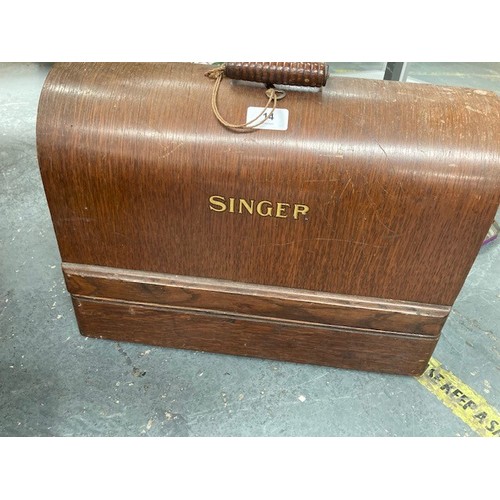 14 - Electric Singer sewing machine in oak case.