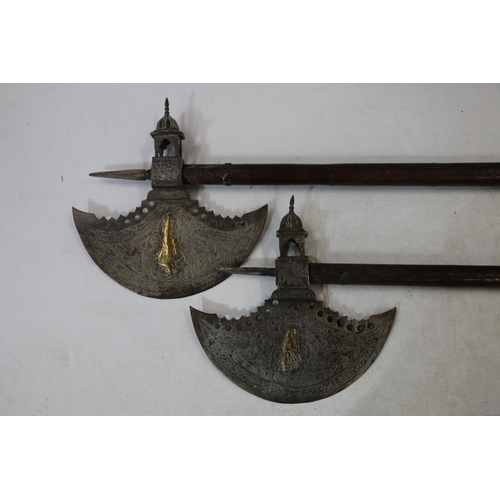 742 - Pair of Indo-Persian ceremonial tabar or saddle axes, the blade decorated with figures picked out in... 