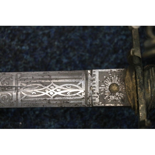 745 - Scottish basket hilted broadsword, the etched blade with scroll designs having ricasso marked for J ... 