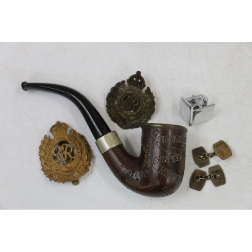 764 - Boer War Prisoner of War carved pipe, a grouse foot brooch, cap badges including Seaforth Highlander... 