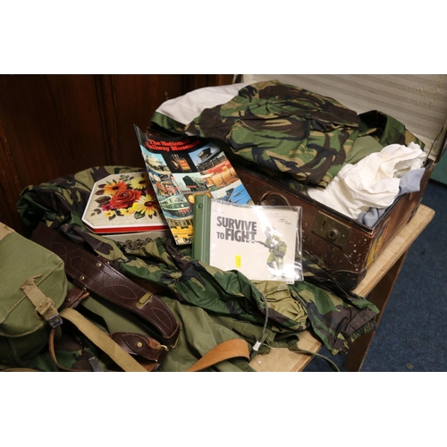 772 - Large collection of army uniform including camouflage smock jacket, waterproof, turtle shell helmet,... 