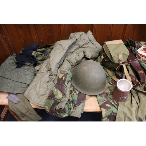 772 - Large collection of army uniform including camouflage smock jacket, waterproof, turtle shell helmet,... 