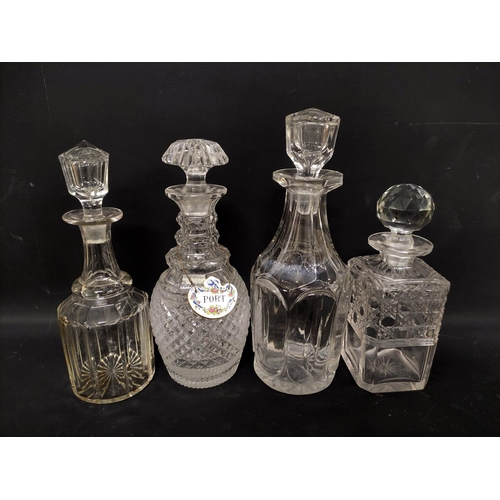 11 - Four cut glass decanters, a flashed amber crystal decanter and five glasses.