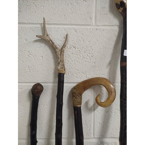 116 - Three walking sticks to include horn handle and a wading stick. (4)