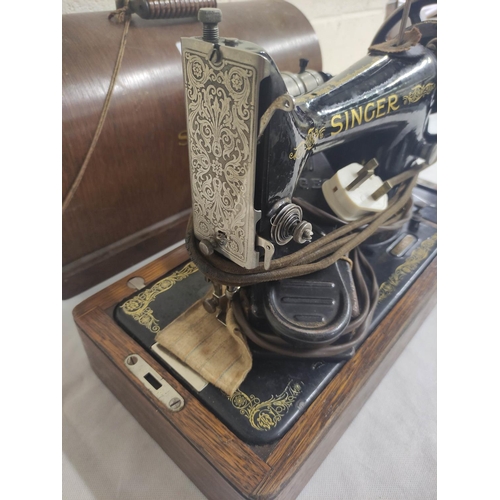 14 - Electric Singer sewing machine in oak case.