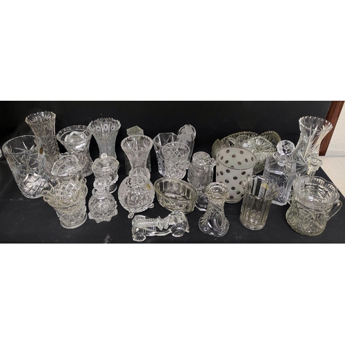 61 - Large quantity of cut and other glassware to include vases, water jugs, jelly moulds, glass candlest... 