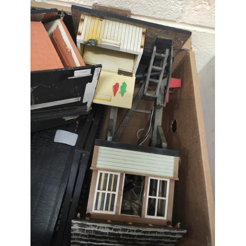 83 - Two boxes of model railway buildings and components to include signal box etc. (2)