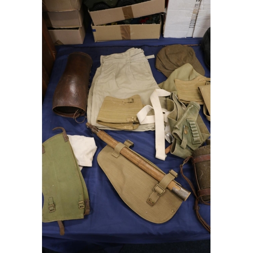 777 - Collection of army uniform and accessories including an entrenching tool, two cloth covered water bo... 