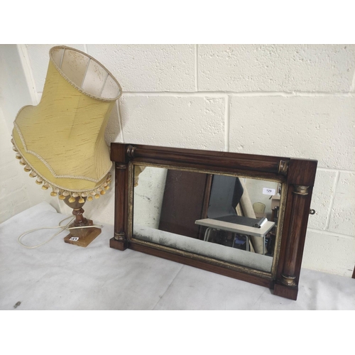 129 - Mahogany antique wall mirror and an onyx table lamp. (2)