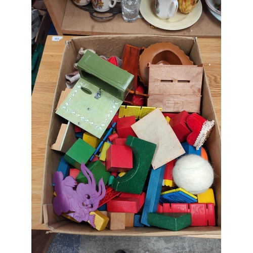 Collection of child's wooden building blocks, doll's house furniture etc.