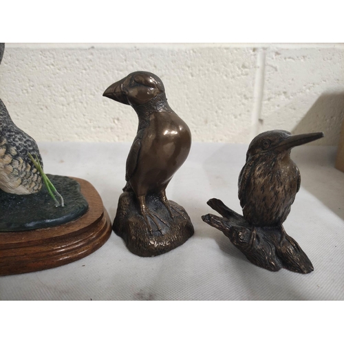 453 - Bronzed puffin figure, a bronzed figure of a kingfisher and a Heritage model of a duck.  (3)