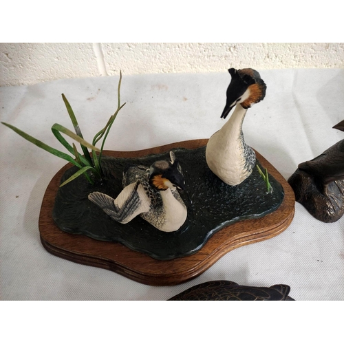 453 - Bronzed puffin figure, a bronzed figure of a kingfisher and a Heritage model of a duck.  (3)