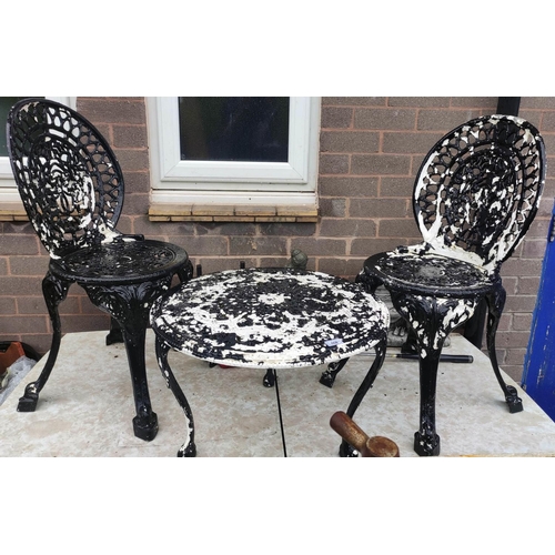 508 - Two seater metal garden table and chairs.