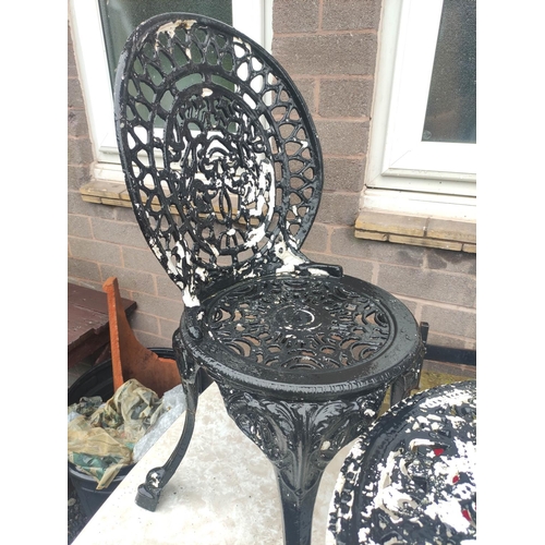 508 - Two seater metal garden table and chairs.