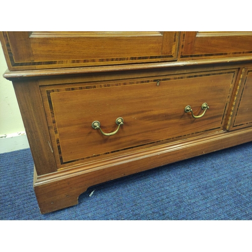 513 - Edwardian mahogany inlaid wardrobe fitted with two drawers to base.