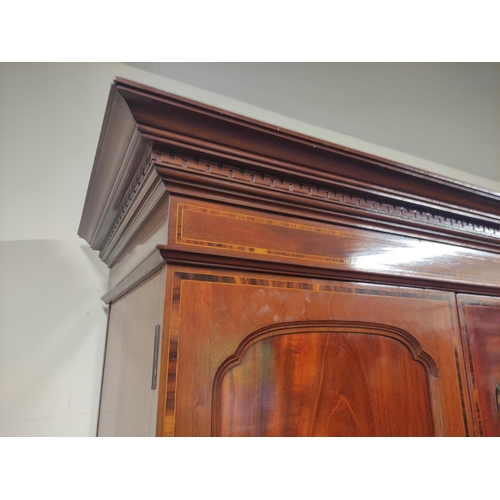 513 - Edwardian mahogany inlaid wardrobe fitted with two drawers to base.