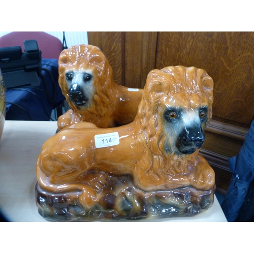 114 - Pair of Scottish Boness pottery recumbent lion figures with glass eyes.  (2)