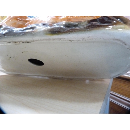 114 - Pair of Scottish Boness pottery recumbent lion figures with glass eyes.  (2)