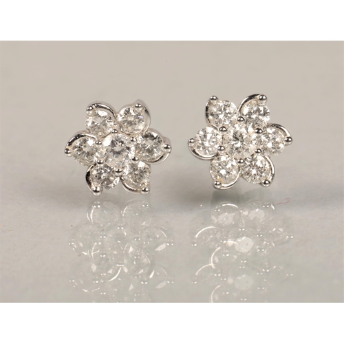 104 - White metal and white stone cluster earrings