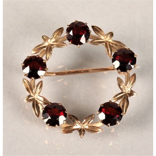 144 - 9ct gold Garnet set brooch