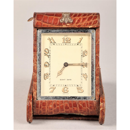 183 - Leather cased yellow metal monogrammed Jaeger Eight Days travel clock