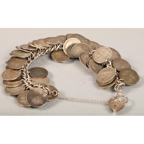 59 - Hallmarked silver chain bracelet with silver heart lock clasp and a large amount of George V threepe... 