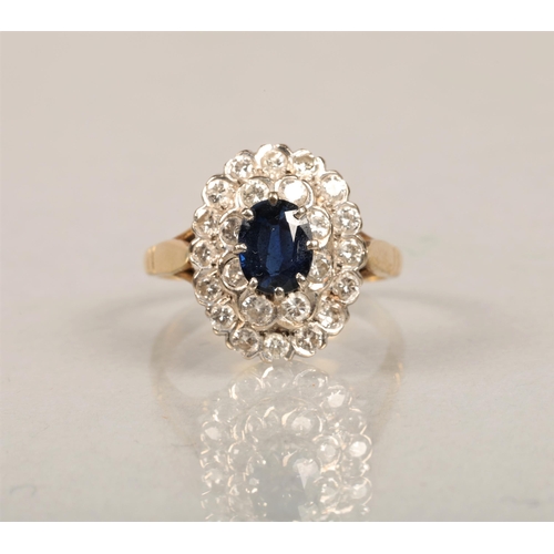 63 - 18ct gold set with diamonds and central sapphire, size P