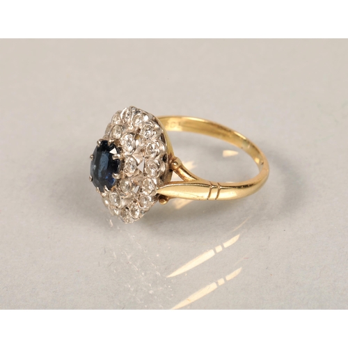 63 - 18ct gold set with diamonds and central sapphire, size P