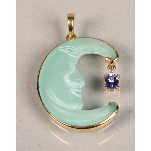 93 - 10 K Gold mounted and opaque glass mounted pendent in form  half moon with purple gem