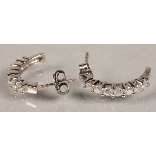 96 - Pair of white metal and diamond earrings