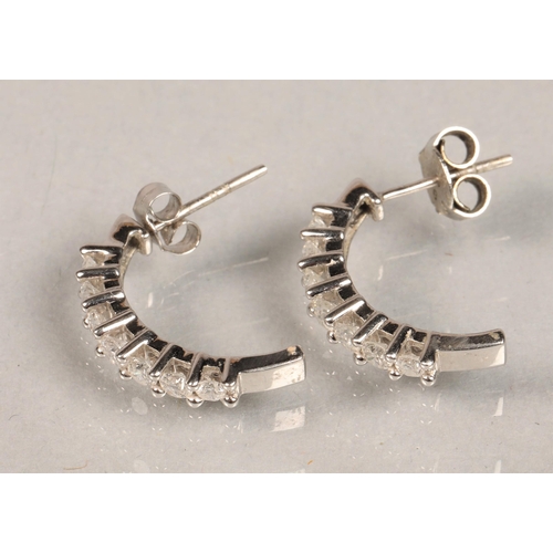 96 - Pair of white metal and diamond earrings