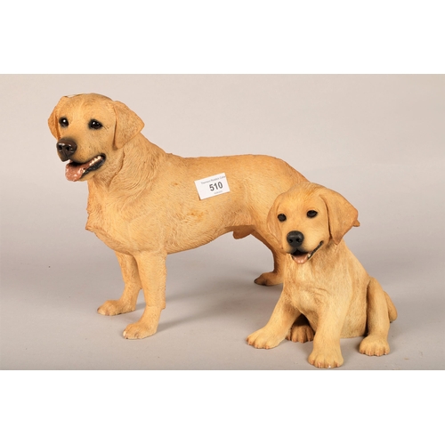 510 - Two decorative golden labrador figures adult and puppy, adult 26cm h