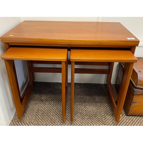 498 - Mid century teak nest of tables (two under one with casters)