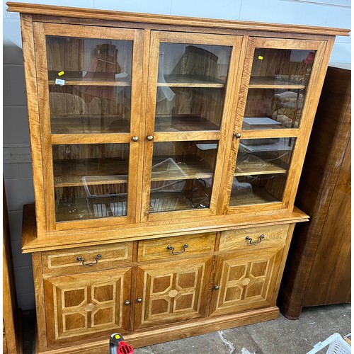 548 - Contemporary oak glazed book case over three drawer and three door cupboard, 204 x 78 x 51 cm