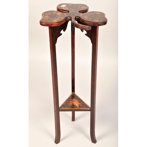 539 - Shamrock shaped mahogany occasional table with lower shelf and marquetry design, 88cm h