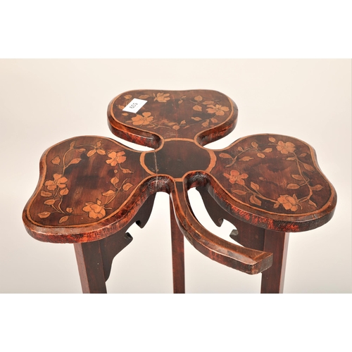 539 - Shamrock shaped mahogany occasional table with lower shelf and marquetry design, 88cm h