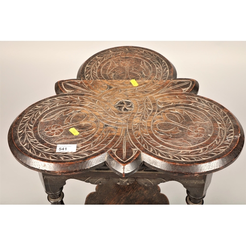 541 - Carved floral design oak occasional table 67cm h