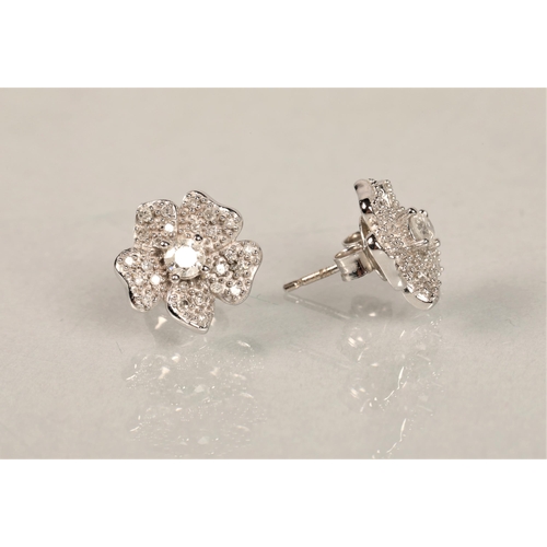 119 - Pair 9ct white gold diamond set flower stud earrings