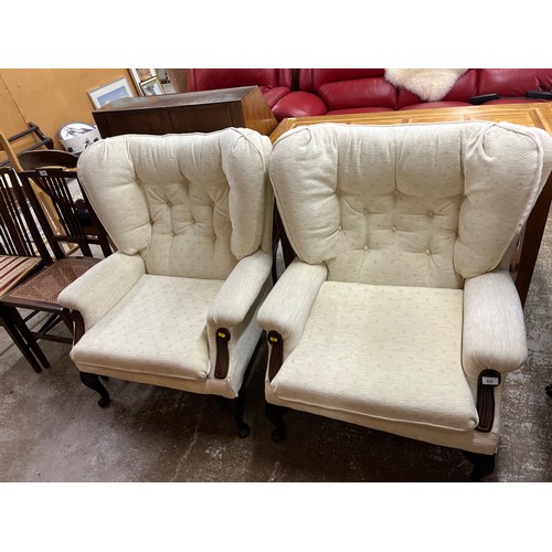 613 - Pair of cream wing easy chairs