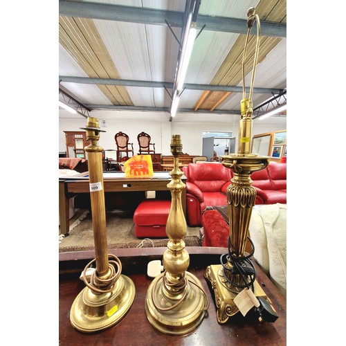 609 - Three brass table lamps