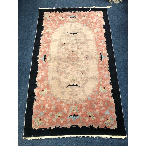 848 - Chinese rug with foliate and bat design, 210 x 127cm.