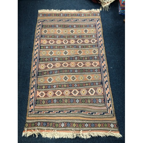 855 - Kilim rug with field having rows of flowerheads, 228 x 132cm.