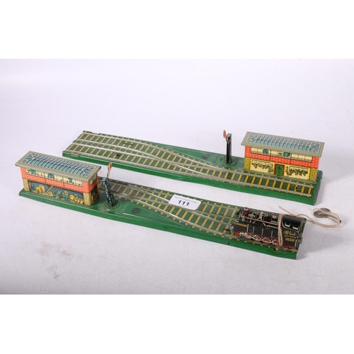 111 - 1970's Gescha toy train sets, 35cm wide.