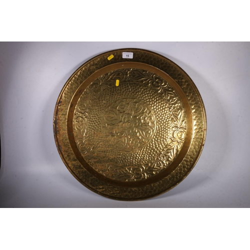 15 - Large brass tray with hammered decoration.