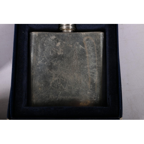 42 - Pewter hip flask, two other flasks and a white metal box with tropical decoration.