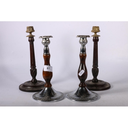 61 - Two pairs of wood and metal mounted candlesticks, 27cm.