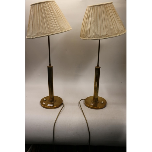 65 - Pair of brass column style table lamps, 72cm with shades.